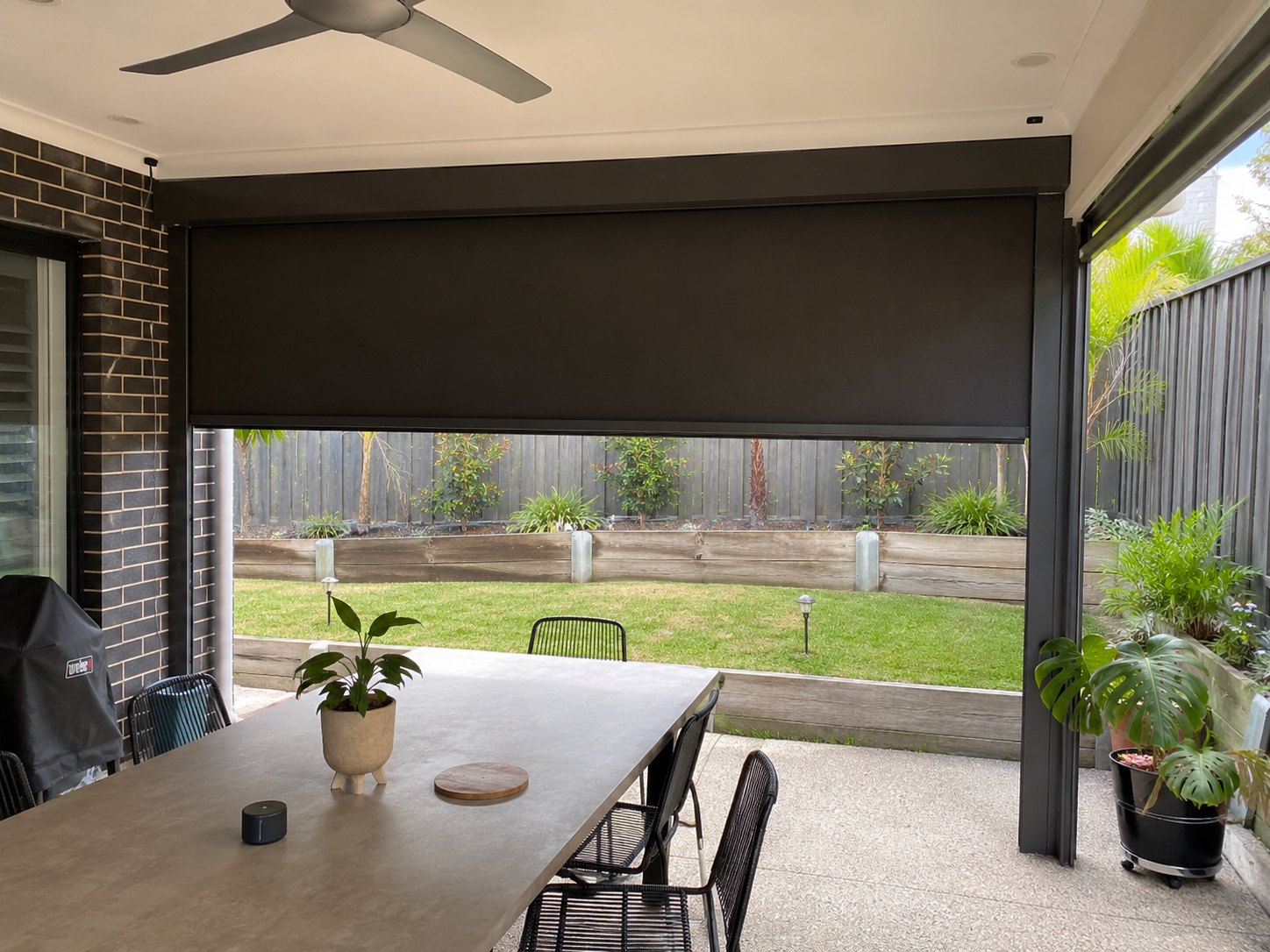 Custom outdoor motorised roller blind installation project in Oakleigh